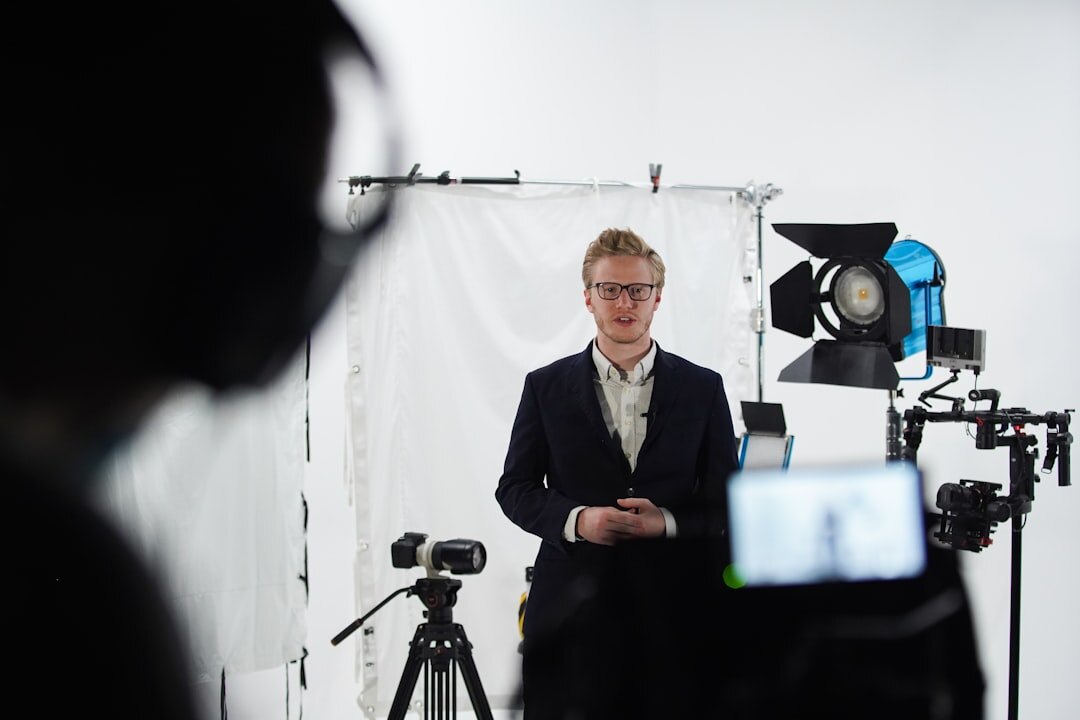 Professional camera operator filming in studio