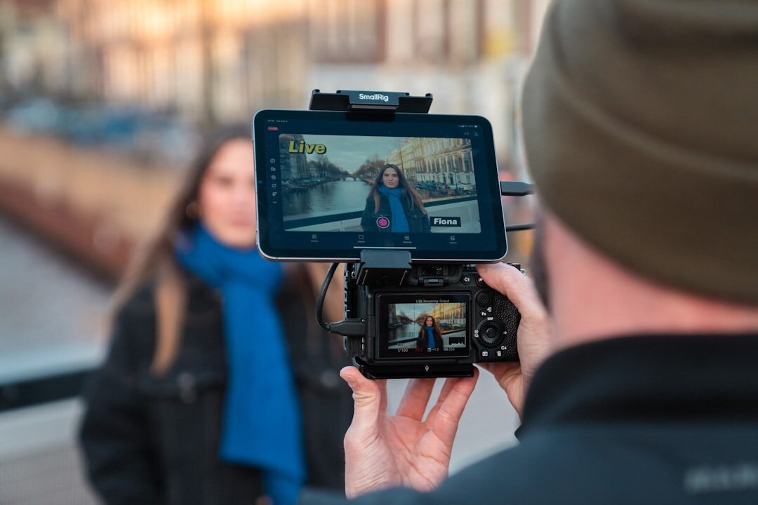 Journalist reporting live on camera outdoors