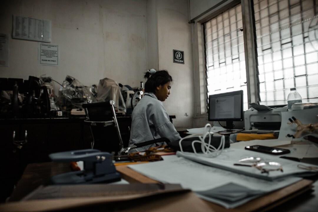 Professional woman at desk with headset and computer